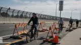 AI-generated illustration: Li: San Jose Airport’s Closure of Vital Bike Route Exposes Hollow Traffic Safety Pledge. Not a photograph of the reported event.
