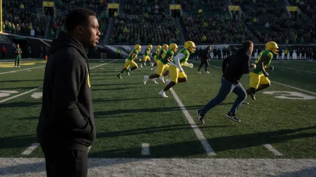 Nov 14, 2025; Eugene, Oregon, USA; Oregon Ducks wide receiver Dakorien Moore watches teammates warm up before a game against the Minnesota Golden Gophers at Autzen Stadium.